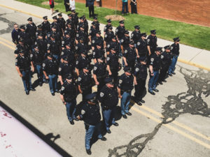 police officers standing in straight lines