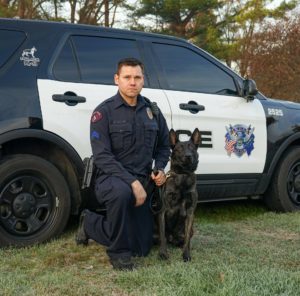 Police officer with his canine unit partner